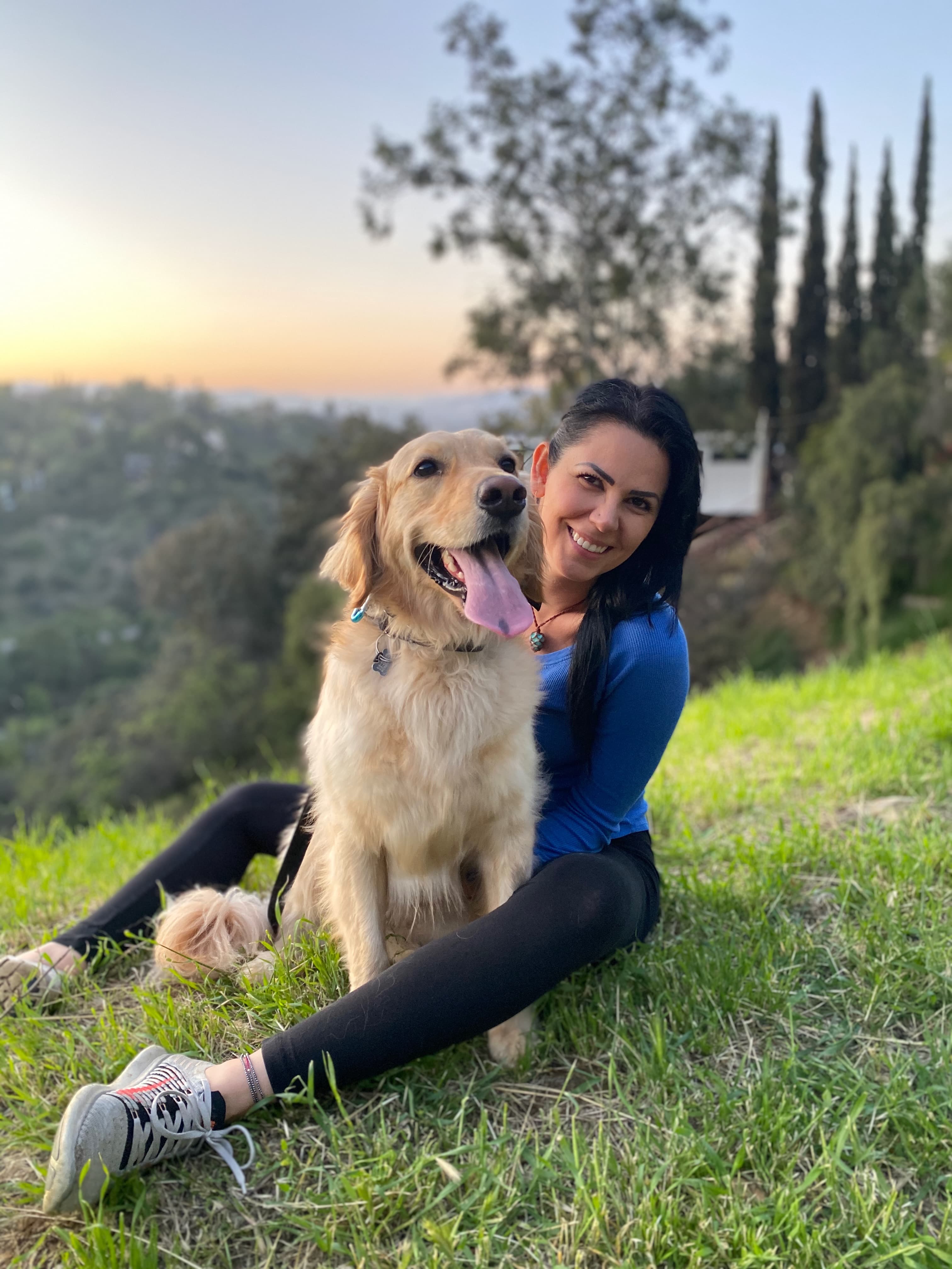 Silvy Khoucasian with her golden retriever Yellowjhan at sunset